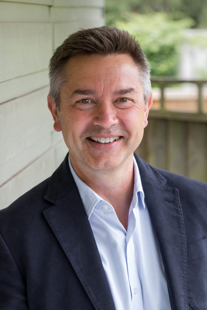 Male headshot outdoors