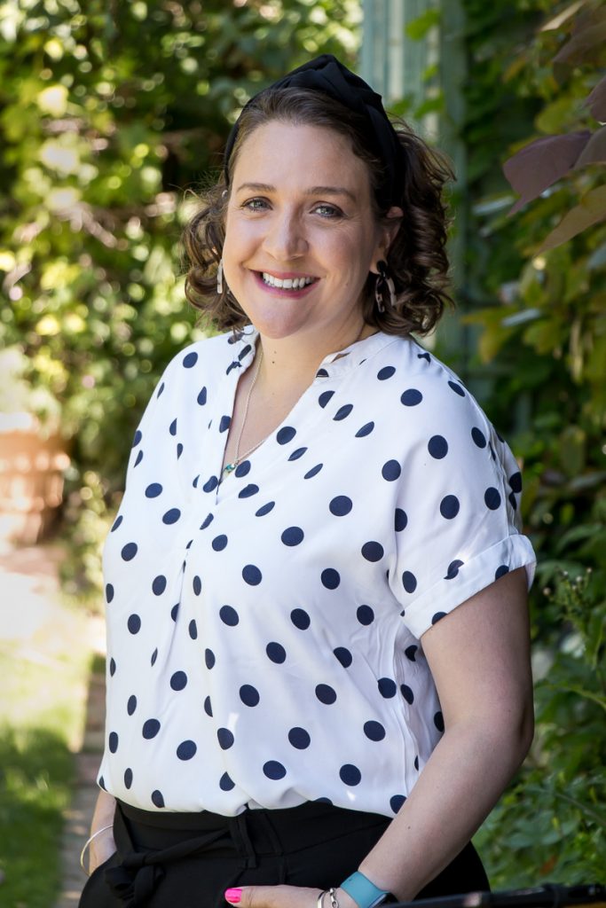 Outdoor headshot of travel agent